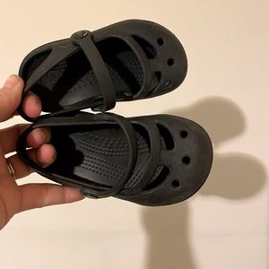 Black Mary Jane toddler crocs.